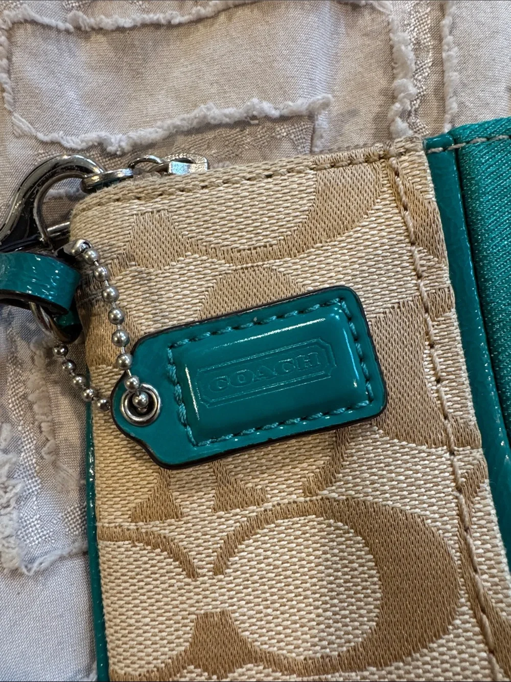 Coach Beige Signature Wristlet with Teal Accent